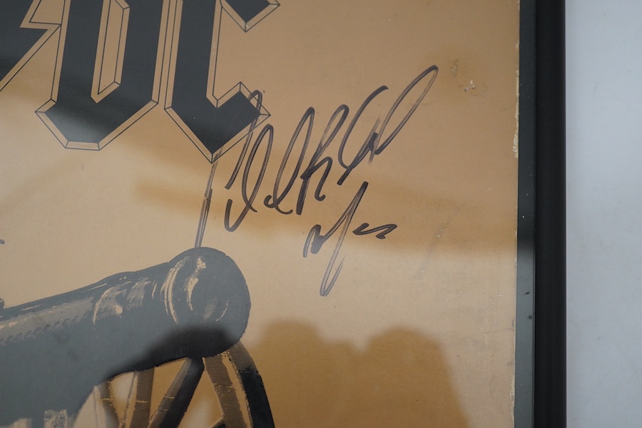 A signed AC/DC album with five autographs of; Angus Young, Phil Rudd, Cliff Williams, Brian Johnson and Malcolm Young, all signed in black felt tip on the cover of the album ‘For Those About To Rock’, framed. Condition -